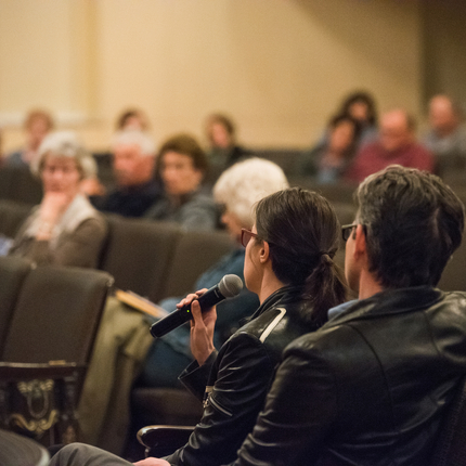 Audience members asking questions