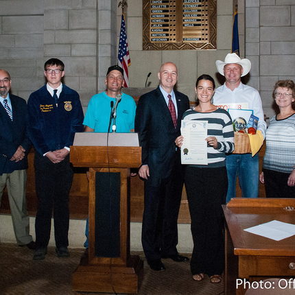 Group of folks with governor and proclamation