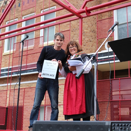 A man and a woman on a trailer stage