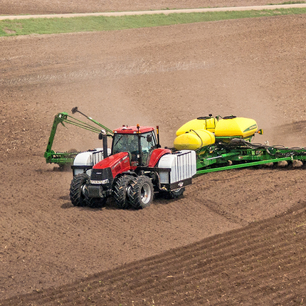 Tractor planting crops