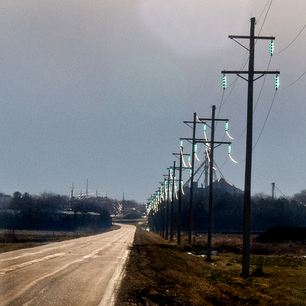 Power line with glass insulators