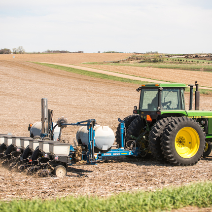 a tractor planting in a field
