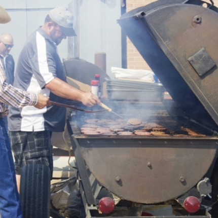 Two men at grill