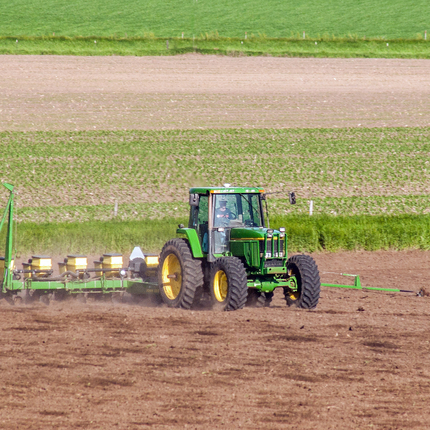 Tractor planting crops