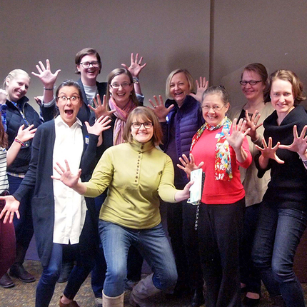 Women at a conference in group photo