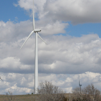 Wind turbine with fluffy clouds