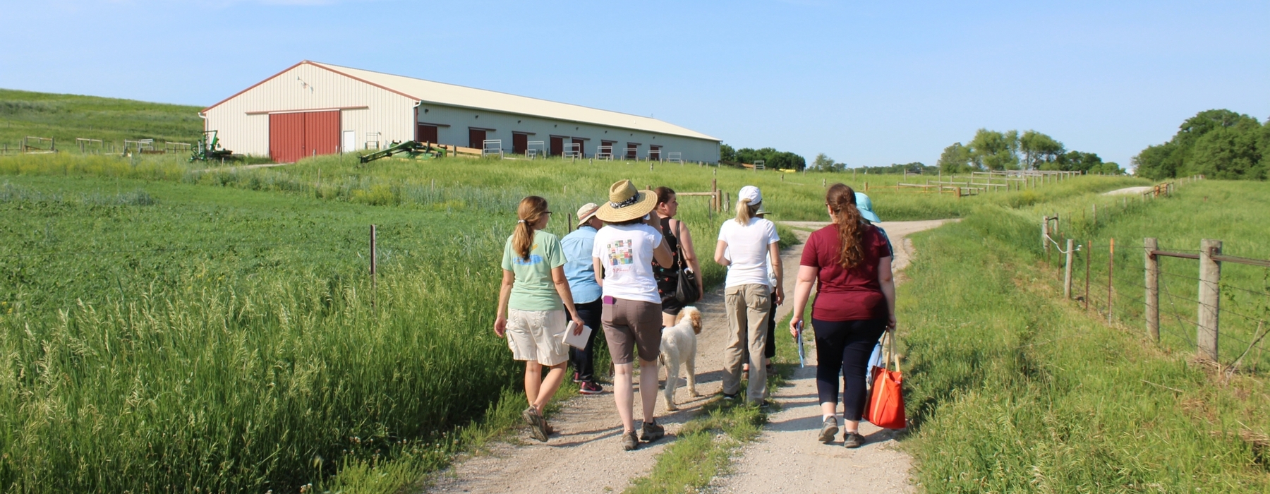 Women landowners walking on farm road
